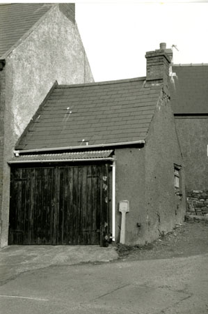 Photograph of a door in a house - formerly the butchers on Main Street